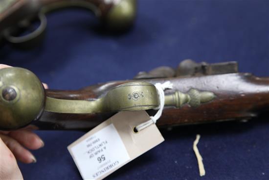 A pair of early 19th century flintlock holster pistols, signed Weston, Lewes, 15in.